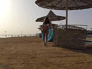 Blonde exhibitionist flashes cute ass and big tits without panties on public beach for thrilling outdoor fun