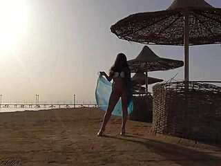 Blonde exhibitionist flashes cute ass and big tits without panties on public beach for thrilling outdoor fun