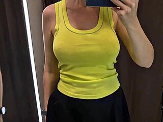 Oh man, i-i mean, those big tits in the dressing room trying on that sexy see-through outfit... wow, it's like spying on her upskirt pussy, all curvy and wet...