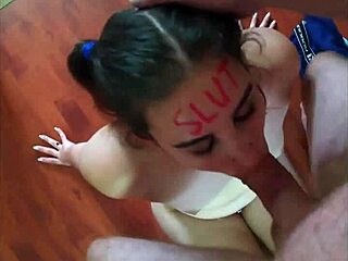 Hey, check out this slut with lipstick writing all over as she sucks cock deep. Then she gets face fucked hard.