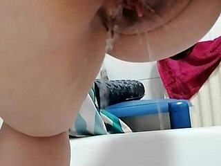 Oh man, watch my girlfriend piss from behind in that wet, shaved pussy close-up!