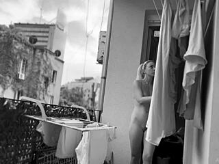 Naked chubby woman casually hangs laundry on balcony while neighbors watch her shaved pussy