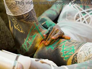 whoa check this tattooed whore in sexy fishnets and highheels doing solo anal play with a huge dildo