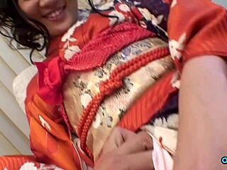Lovely geisha-looking Asian babe flashes her skirt upskirt and rubs to orgasm in casting