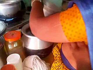 Watch this hot desi bhabhi cooking up steamy homemade action in the kitchen with her roommate!