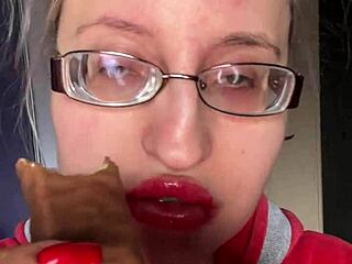 giantess with big lips and eyeglasses contrasts huge tall fetish while eating snickers protein bar