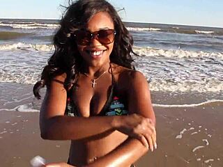 Ebony beauty boldly strips naked shaking big ass at public beach