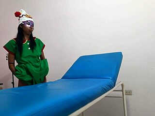 In the massage parlor, dressed as a goblin woman, she rides a dildo while waiting for her boyfriend's arrival.