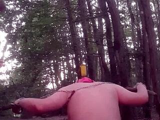 Outdoor femdom session with face sitting and wet BDSM play in the forest
