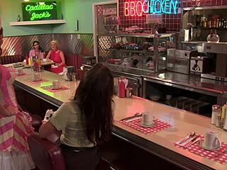 She spreads her shaved pussy on the bed in fishnets and heels, taking deep anal fingering and licks.