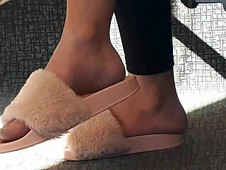 look at this candid shoeplay from a stunning brunette in pink slides on the train