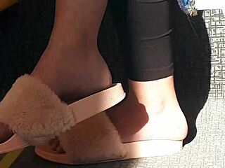 look at this candid shoeplay from a stunning brunette in pink slides on the train