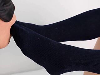 casual story of cute uniform girl giving footjob in navy socks to her kinky friend
