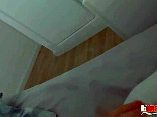 sexy latina milf shares bed with horny guy and masturbates right next to him