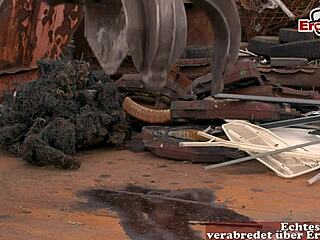 Hey, how does this German redhead milf with big tits handle anal in an outdoor threesome?