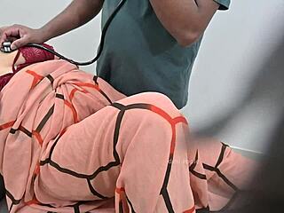 indian doctor examines lady patient closely