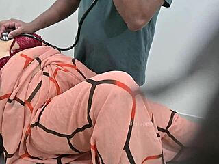 indian doctor examines lady patient closely