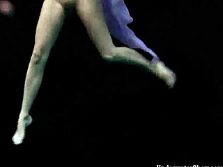 aneta dives nude into pool underwater